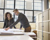 Transform Your Office with Eco-Friendly Commercial Refurbishments Team Looking at Plans