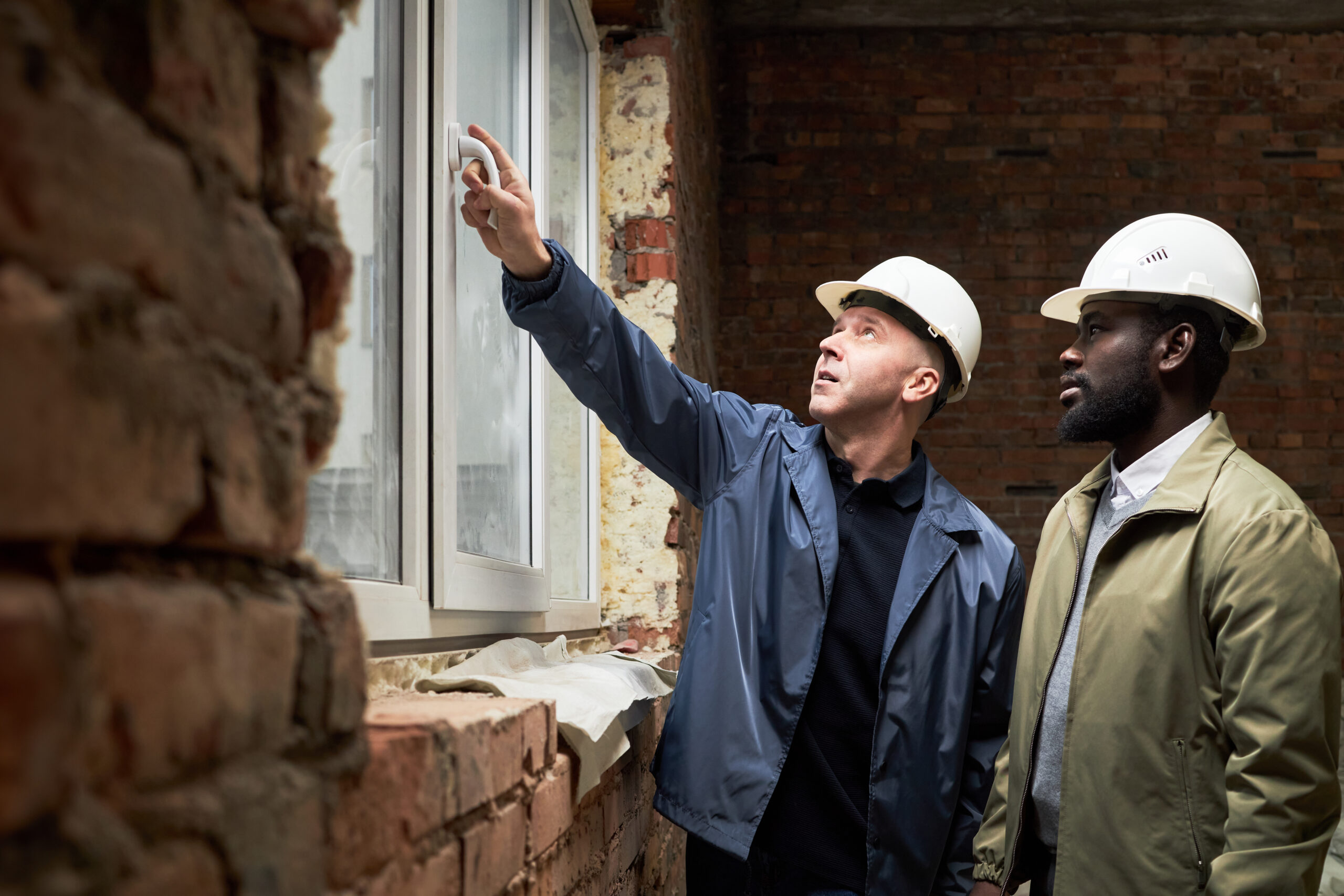 Essential Tips to Meet Building Safety Codes and Ensure Full Compliance - Inspecting Windows